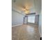 Spacious bedroom with a window and tile flooring at 196 Westmoreland Cir, Kissimmee, FL 34744