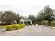 Gated community entrance provides security, privacy, and manicured landscape at 2302 Midtown Ter # 1228, Orlando, FL 32839