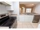 Kitchen area featuring stainless steel appliances and easy access to the breakfast bar at 2302 Midtown Ter # 1228, Orlando, FL 32839