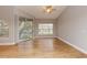 Bright living room with wood floors, neutral walls, ceiling fan and sliding door to balcony at 2302 Midtown Ter # 1228, Orlando, FL 32839