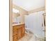 Clean bathroom with wood vanity, granite countertop, and shower/tub combo at 236 Afton Sq # 103, Altamonte Springs, FL 32714