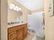 Clean bathroom with wood vanity, granite countertop, and shower/tub combo at 236 Afton Sq # 103, Altamonte Springs, FL 32714