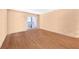 Bright bedroom with hardwood floors and a door leading to a balcony at 236 Afton Sq # 103, Altamonte Springs, FL 32714