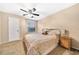 Spacious bedroom with carpeted floor, ceiling fan, and king-size bed at 236 Afton Sq # 103, Altamonte Springs, FL 32714