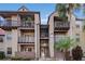 Two-story condo building with balconies and a staircase during the day at 236 Afton Sq # 103, Altamonte Springs, FL 32714