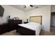 Bedroom with dark wood furniture and a comfortable bed at 2408 Addison Creek Dr, Kissimmee, FL 34758