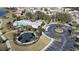 Aerial view of community pool, playground, and parking at 2408 Addison Creek Dr, Kissimmee, FL 34758