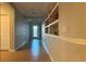 Bright hallway with tile flooring and built-in shelving at 2408 Addison Creek Dr, Kissimmee, FL 34758