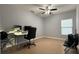 Home office featuring a desk, chair, and ample natural light at 2408 Addison Creek Dr, Kissimmee, FL 34758