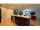 Kitchen island with granite countertop and modern pendant lighting at 2408 Addison Creek Dr, Kissimmee, FL 34758