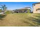 Large, grassy backyard with a covered patio, great for outdoor enjoyment at 2530 Domenico Paul Way, Orlando, FL 32810