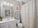 Bathroom with white vanity, toilet, and shower/tub combo at 2530 Domenico Paul Way, Orlando, FL 32810