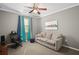 Comfortable bedroom with neutral carpet, a sofa, and a modern ceiling fan at 2530 Domenico Paul Way, Orlando, FL 32810