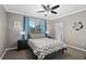 Bedroom with gray and teal decor and a double bed at 2530 Domenico Paul Way, Orlando, FL 32810