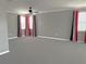 Large room with neutral carpet and ceiling fan with ample natural light at 2530 Domenico Paul Way, Orlando, FL 32810