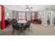 Spacious game room area featuring a poker table, desk, and ample room for entertaining at 2530 Domenico Paul Way, Orlando, FL 32810
