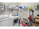 Laundry room with washer, dryer, and ample storage at 2530 Domenico Paul Way, Orlando, FL 32810