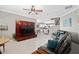 Comfortable living room with a large, mounted TV and matching leather couches at 2530 Domenico Paul Way, Orlando, FL 32810