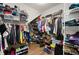 Spacious walk-in closet with custom shelving and ample storage for clothes, shoes, and accessories at 2530 Domenico Paul Way, Orlando, FL 32810
