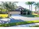 Tan one-story house with a brown door and two-car garage at 2612 Keswick Ct, Kissimmee, FL 34744