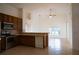 Kitchen with wood cabinets, stainless steel appliances and tile floor at 2612 Keswick Ct, Kissimmee, FL 34744