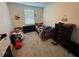 bedroom with a wooden bed frame and carpeted floor at 2900 Title St, Kissimmee, FL 34746