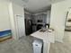 Modern kitchen with gray cabinets, stainless steel appliances, and quartz countertops at 2900 Title St, Kissimmee, FL 34746