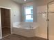 Spa-like bathroom with corner soaking tub and walk-in shower at 2916 Crest Wave Dr, Clermont, FL 34711