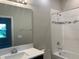 Clean bathroom with shower/tub combo and updated vanity at 2916 Crest Wave Dr, Clermont, FL 34711