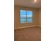 Bedroom with water view and large window with blinds at 2916 Crest Wave Dr, Clermont, FL 34711