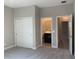 Bright bedroom with double door closet and en-suite bath at 2916 Crest Wave Dr, Clermont, FL 34711