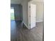 Clean hallway with tile floors and access to rooms at 2916 Crest Wave Dr, Clermont, FL 34711