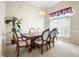 Formal dining room with wood table and six chairs at 2920 River Birch Dr, Kissimmee, FL 34741