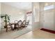 Formal dining room with wood table, six chairs, and entryway view at 2920 River Birch Dr, Kissimmee, FL 34741