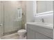 Clean bathroom with single vanity, walk-in shower, and toilet at 3015 Kensington Ave, Davenport, FL 33837