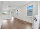 Open hallway with hardwood floors and modern glass railing at 3015 Kensington Ave, Davenport, FL 33837