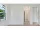 Bright hallway with neutral walls and tile flooring at 3015 Kensington Ave, Davenport, FL 33837