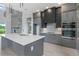 Modern kitchen with gray cabinetry and a large island at 3015 Kensington Ave, Davenport, FL 33837