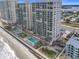 Oceanfront building with pool and landscaped grounds at 3311 S Atlantic Ave # 1402, Daytona Beach, FL 32118