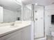 Clean bathroom with single vanity and walk-in shower at 3311 S Atlantic Ave # 1402, Daytona Beach, FL 32118