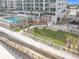 Convenient dog park with grassy area and walkway access at 3311 S Atlantic Ave # 1402, Daytona Beach, FL 32118