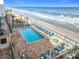 Oceanfront pool and sundeck with lounge chairs and hot tub at 3311 S Atlantic Ave # 1402, Daytona Beach, FL 32118