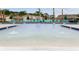 Community pool with blue lounge chairs and water features at 3570 Fort Mellon Ln, Sanford, FL 32773