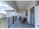 Covered balcony with seating and lovely views at 4012 Breakview Dr # 405, Orlando, FL 32819