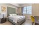 Bright bedroom with a queen bed and a workspace at 4012 Breakview Dr # 405, Orlando, FL 32819