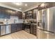 Modern kitchen with stainless steel appliances and dark wood cabinets at 4012 Breakview Dr # 405, Orlando, FL 32819