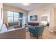 Open concept living room with sectional sofa and access to bedroom at 4012 Breakview Dr # 405, Orlando, FL 32819