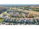 Wide aerial view of the community, showing numerous buildings, landscaping, and a nearby lake at 4818 Marks Ter # 385 B2, Orlando, FL 32811