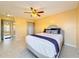 Main bedroom with a queen-size bed and ensuite bathroom at 4818 Marks Ter # 385 B2, Orlando, FL 32811