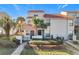 Front view of townhome with walkway, landscaping, and a two-car garage at 4818 Marks Ter # 385 B2, Orlando, FL 32811